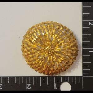 Vintage gold Coro burst dome brooch